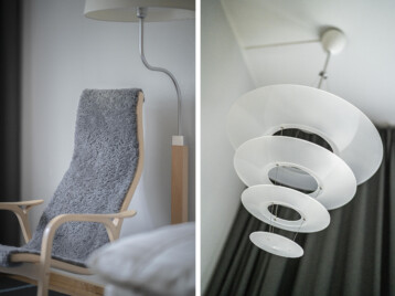 detaljbilder på en designer stol med mjukt fårskinn och en taklampa i glas